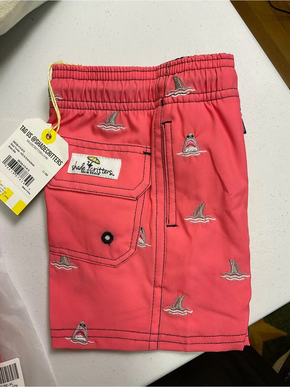 Shark Bite Boys 4 Way Stretch Water Appearing Embroidered Swim Trunks - Coral